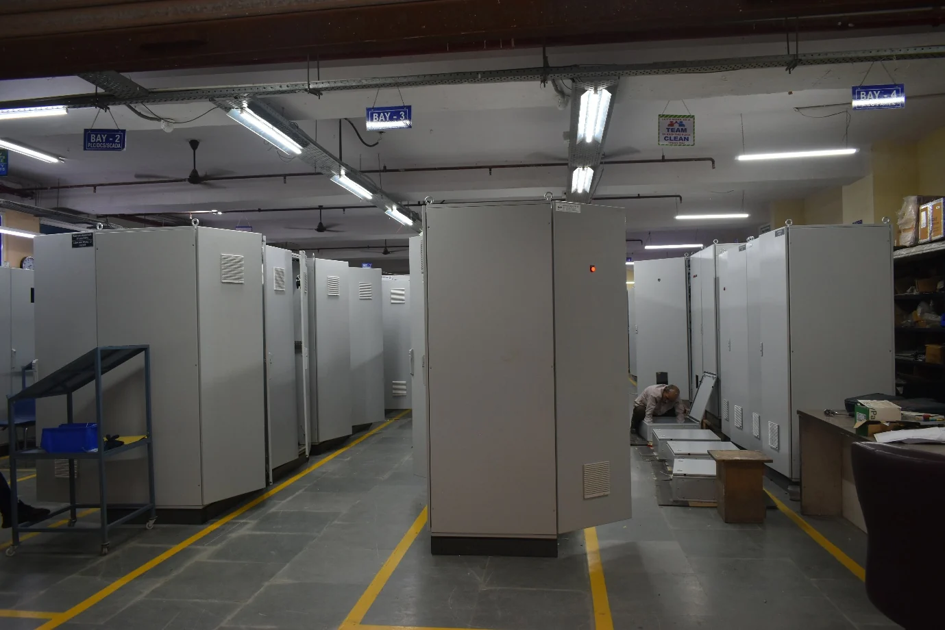 Elcon manufacturing floor with rows of electrical panel cabinets